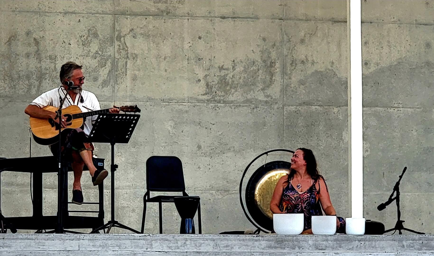 Ray Songs on guitar and harmonica with Tej Fuls performing at Waterloo Greenway in Austin, Texas